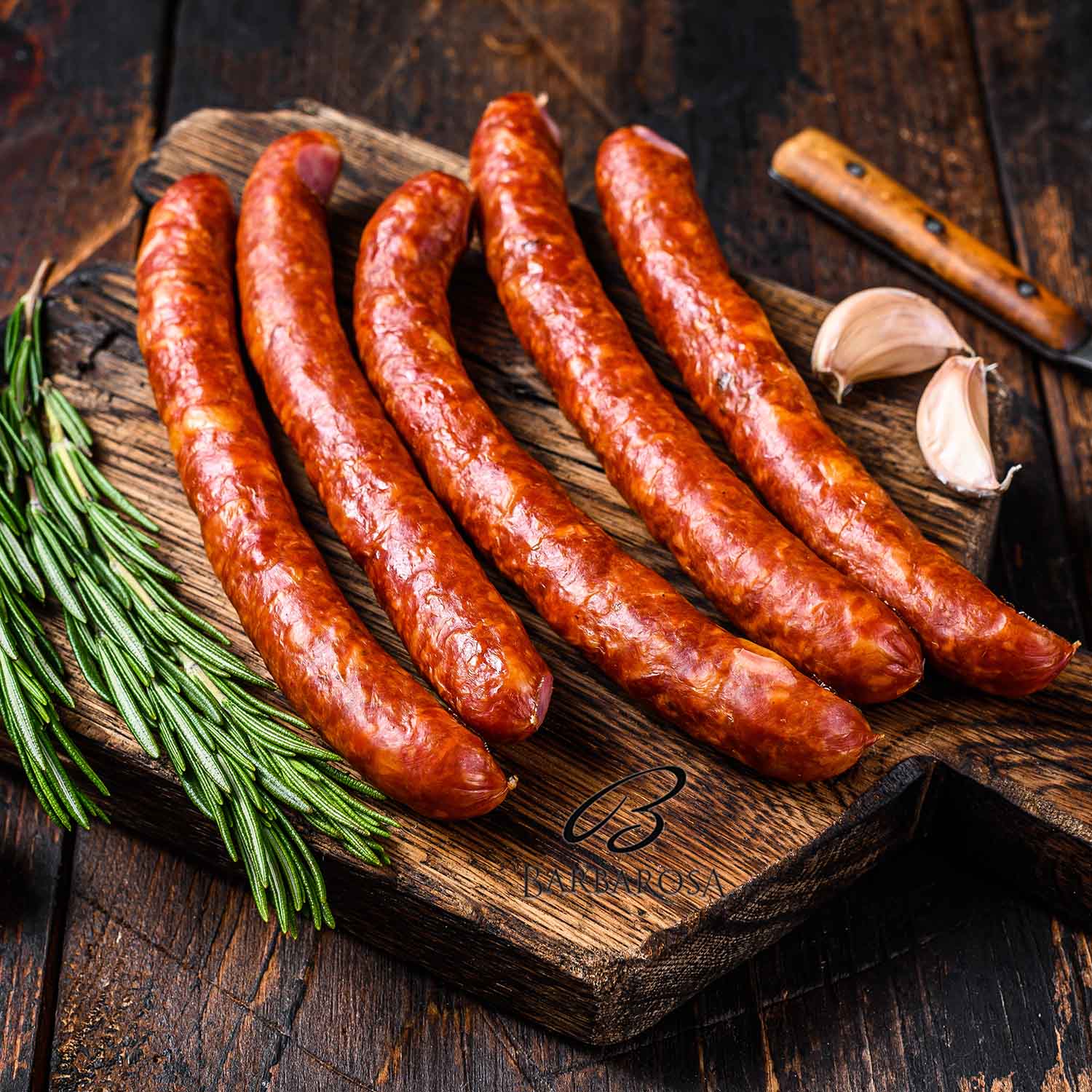 Hot Smoked sausages with addition of fresh aromatic herbs and sp