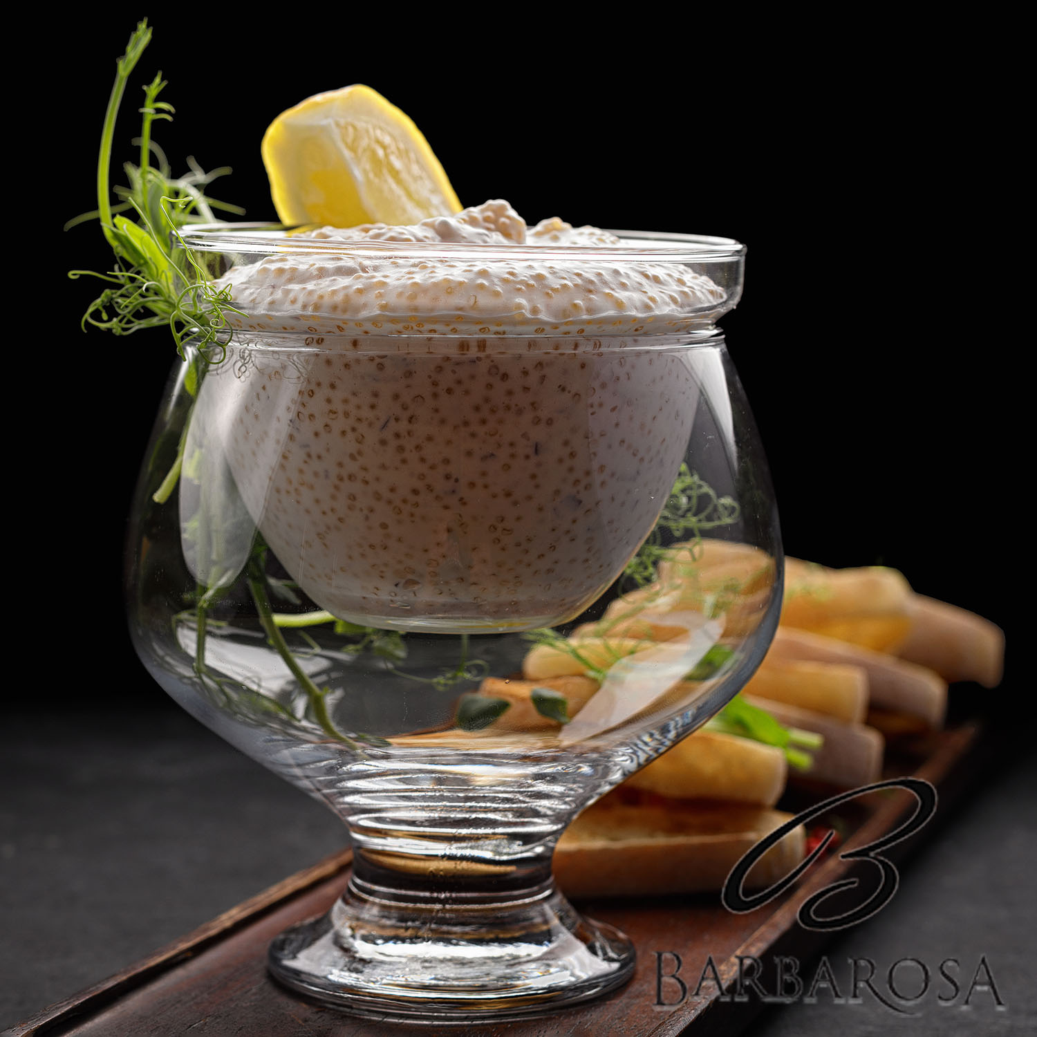 Pike caviar with toast on a wooden board